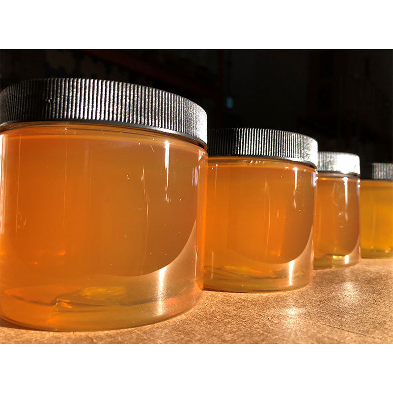 Brown Rice Syrup jars without labels golden color